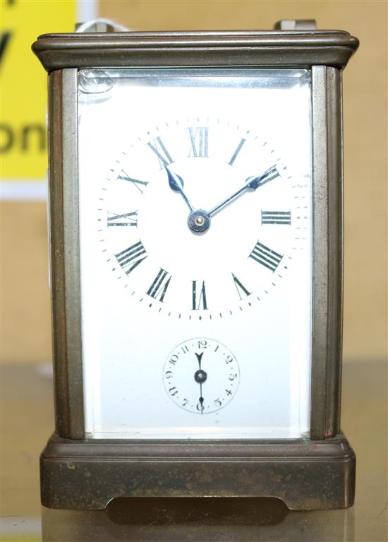 A brass carriage timepiece with alarm